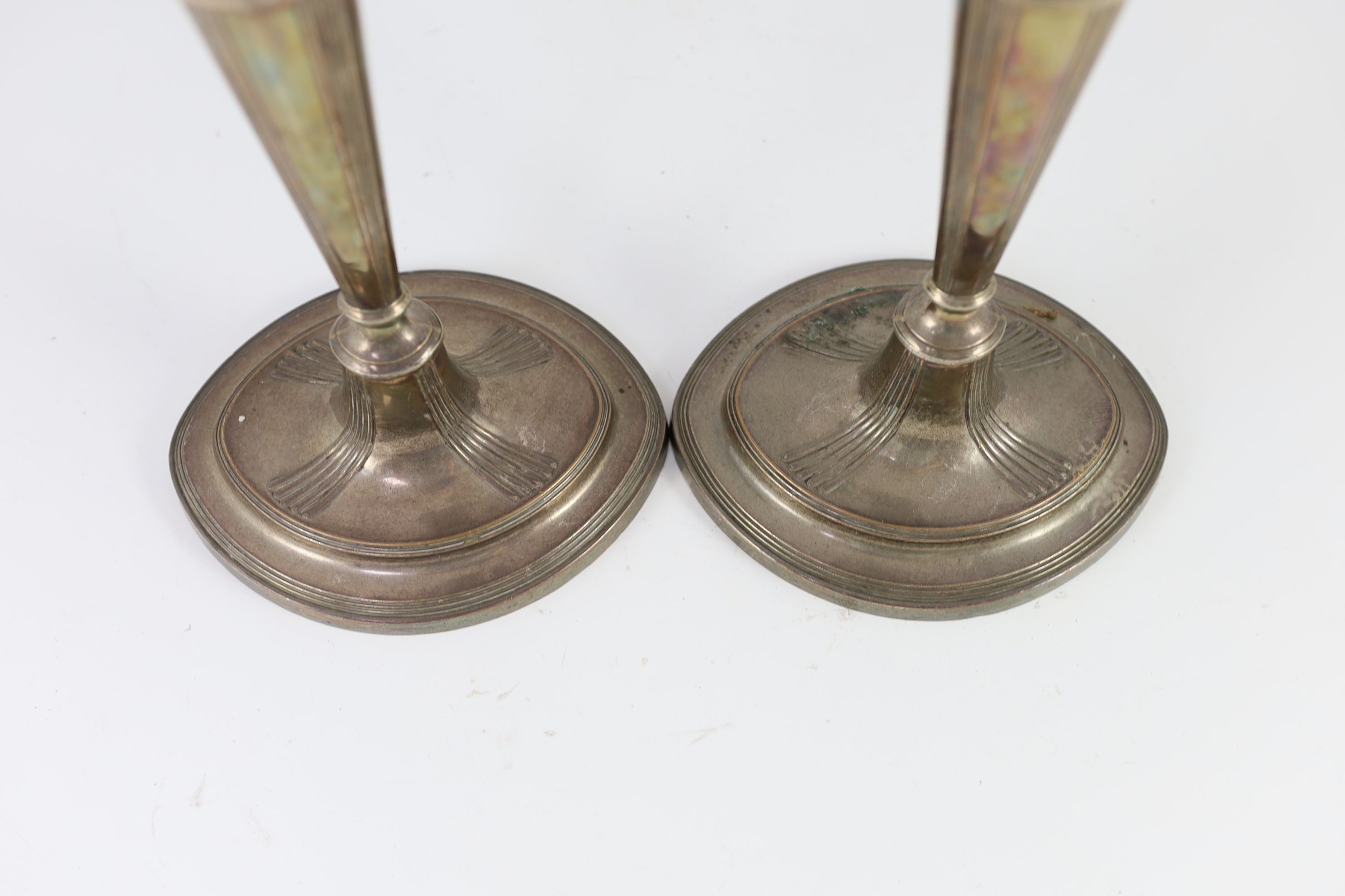 A pair of Sheffield plate candlesticks and nozzles, 32cm high